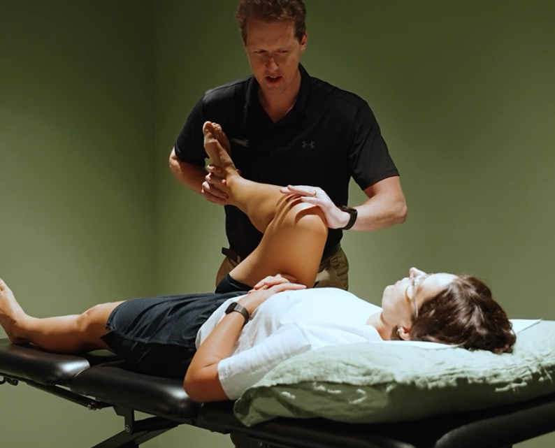 Physio matt assessing a knee