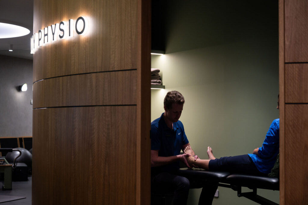 Physio Matt treating a foot in a treatment room