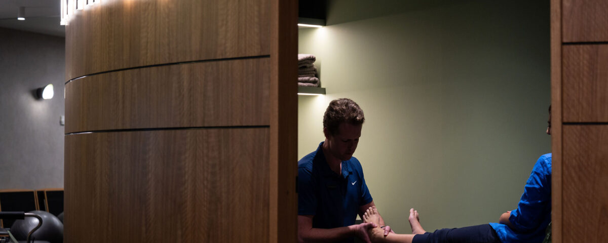 Physio Matt treating a foot in a treatment room